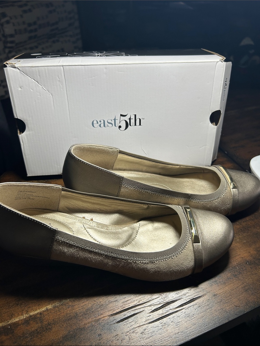 East5th- Metallic gold slight wedge with decorative gold bar on toe.